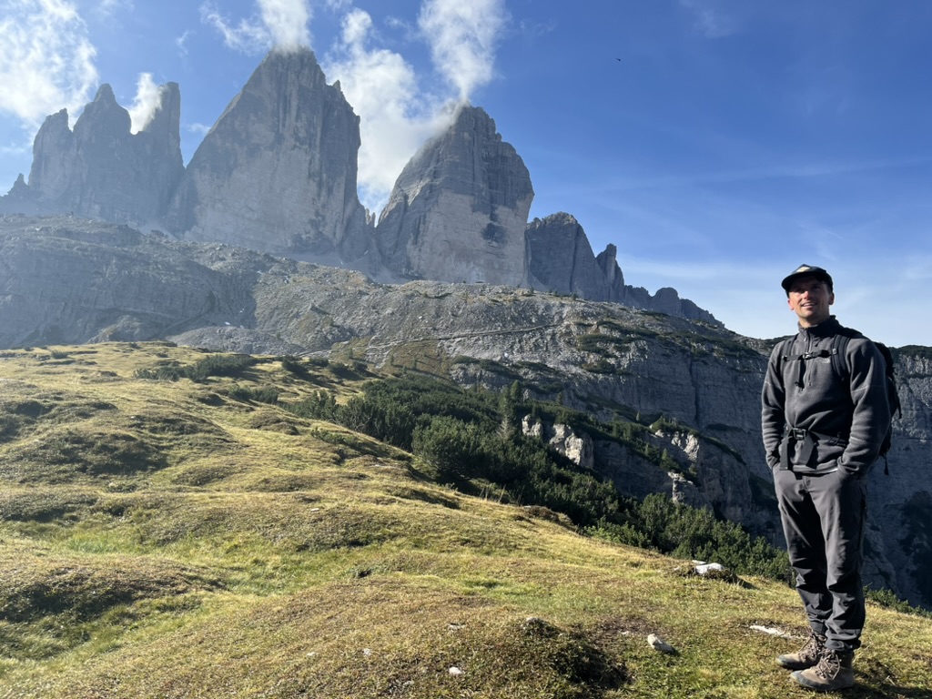 Paul, founder of The Alpines, hiking below the Tre Cime di Lavaredo in the Dolomites